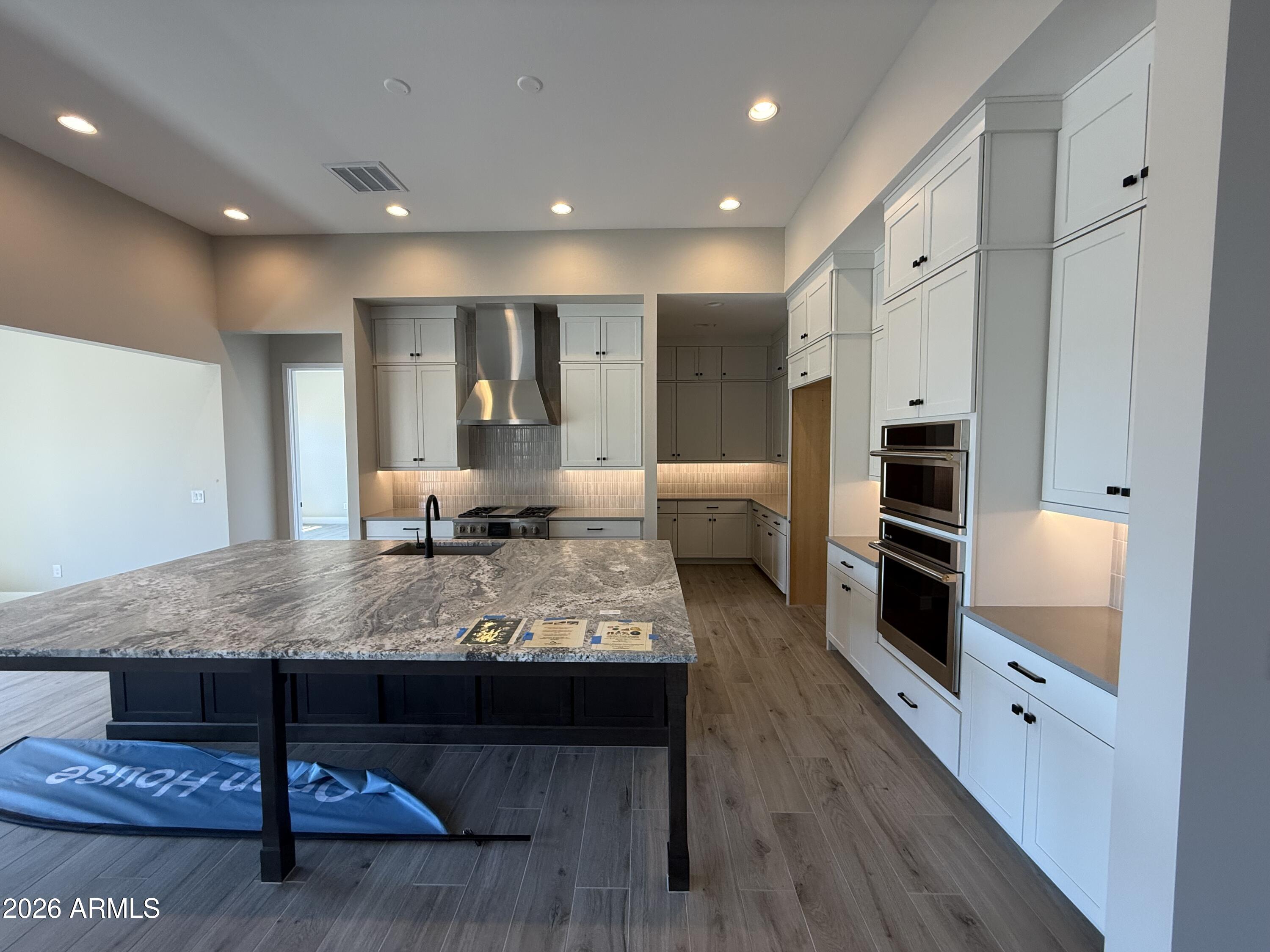 11139 East Rio Bravo Road Gold Canyon, AZ 85118 - Photo 4 of 14 a view of living room kitchen with stainless steel appliances cabinets