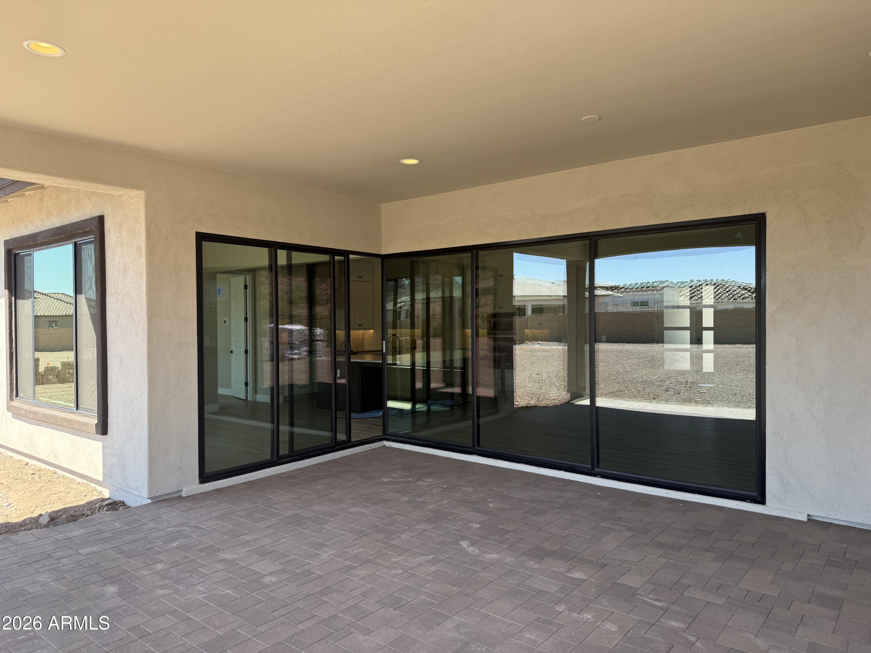11139 East Rio Bravo Road Gold Canyon, AZ 85118 - Photo 6 of 14 a view of an empty room with glass door