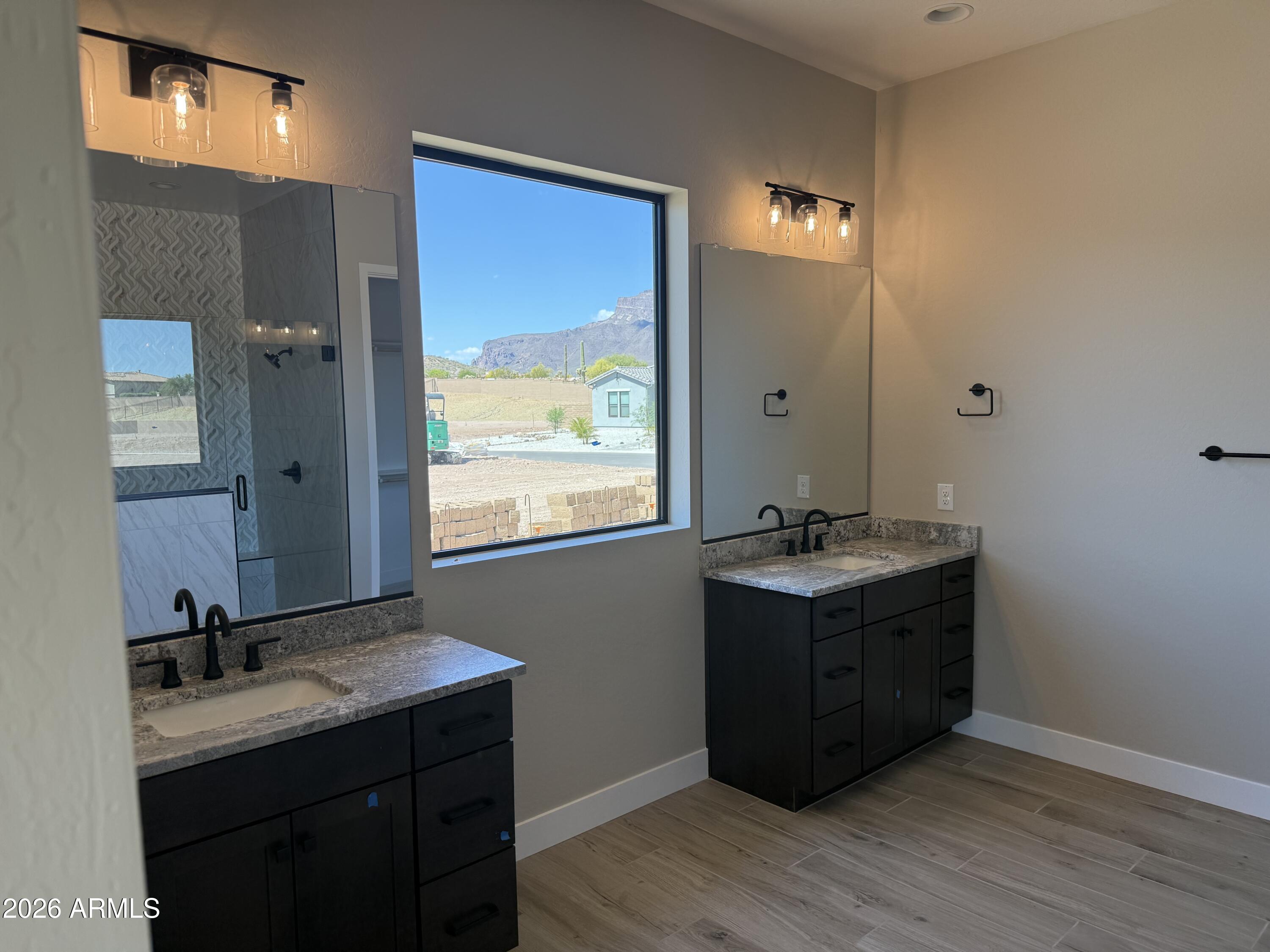 11139 East Rio Bravo Road Gold Canyon, AZ 85118 - Photo 8 of 14 a bathroom with a granite countertop sink a mirror and a window