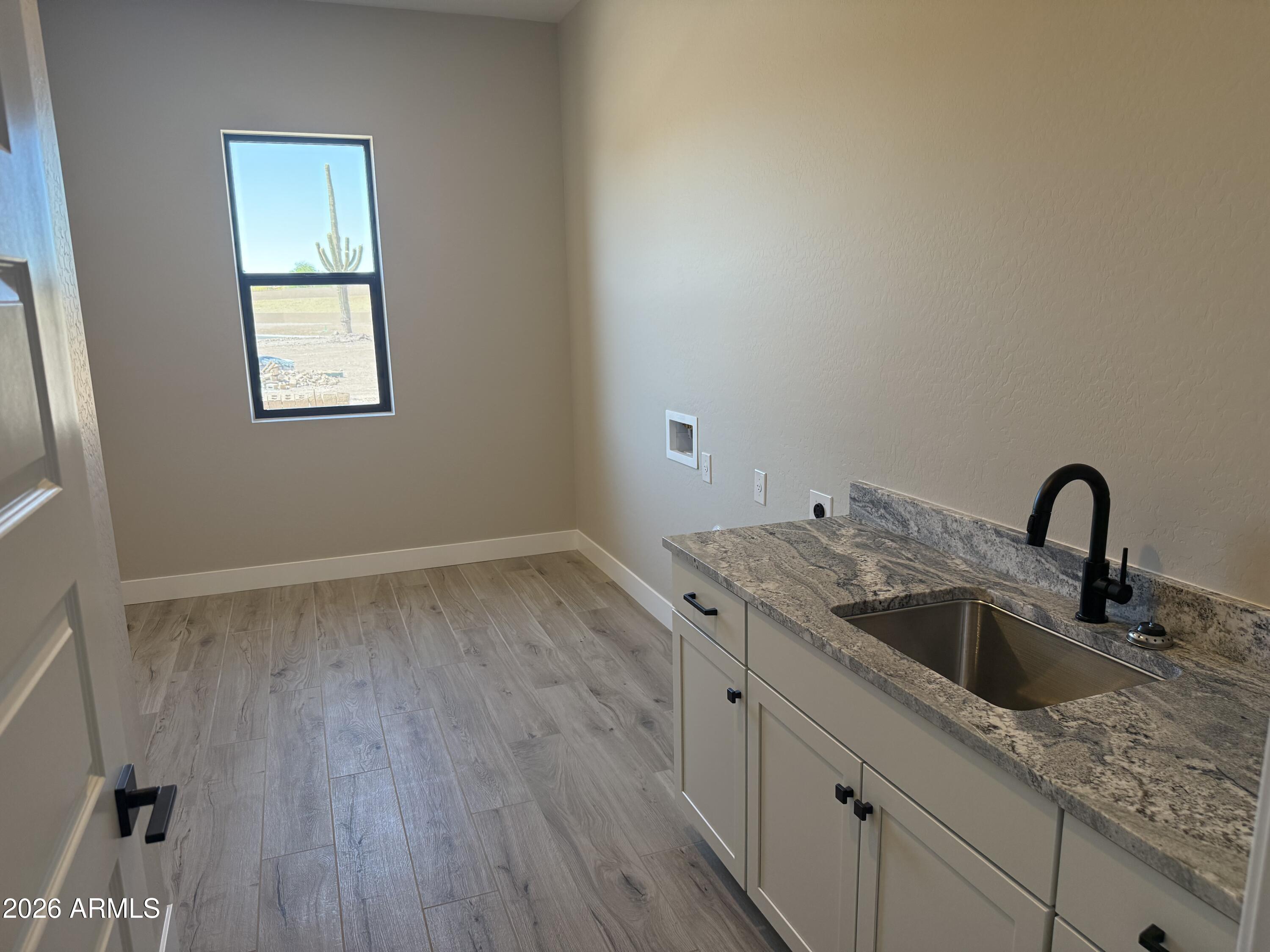 11139 East Rio Bravo Road Gold Canyon, AZ 85118 - Photo 9 of 14 a kitchen with a sink and cabinets