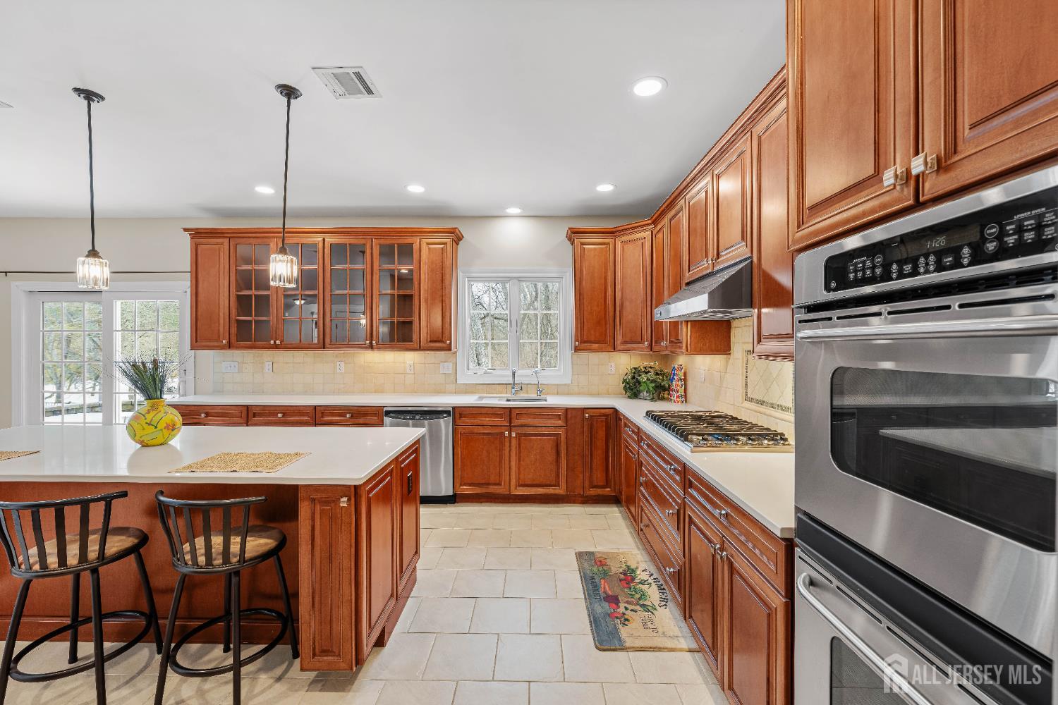 32 4 Bridges Road Chester, NJ 07930 - Photo 16 of 78 a kitchen with a stove a sink and a wooden cabinets