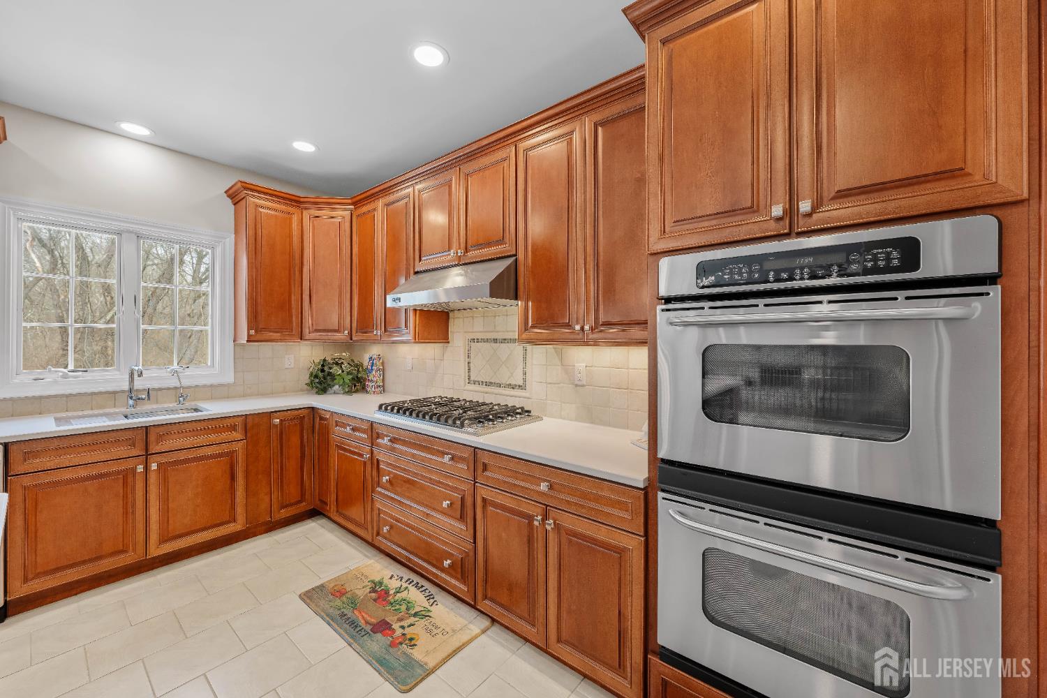 32 4 Bridges Road Chester, NJ 07930 - Photo 17 of 78 a kitchen with granite countertop a stove sink and cabinets
