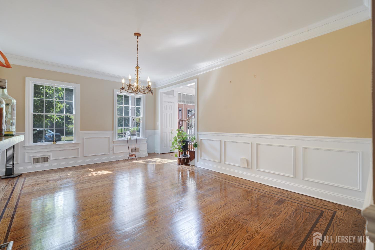 32 4 Bridges Road Chester, NJ 07930 - Photo 8 of 78 a view of an empty room with wooden floor and a window