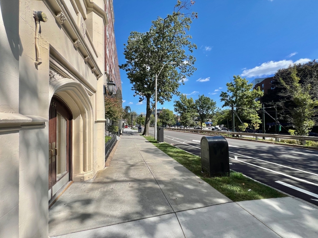1454 Beacon Street, Unit 744 Brookline, MA 02446 - Photo 17 of 18 a view of a pathway of a building with garden