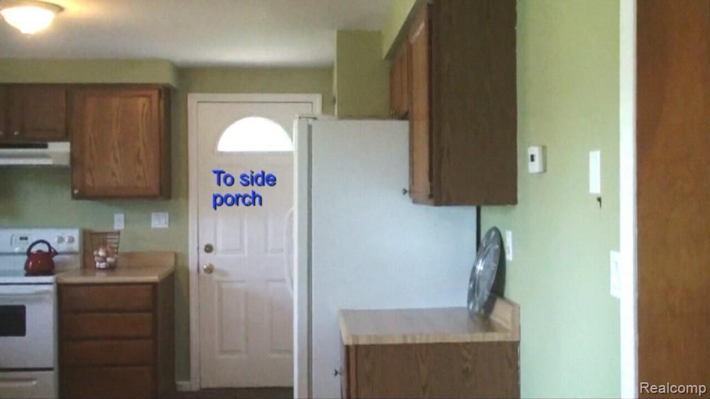 2136 Granger Road Oxford, MI 48371 - Photo 40 of 95 kitchen to side porch.jpg