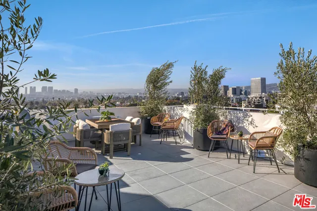 a view of a terrace with furniture
