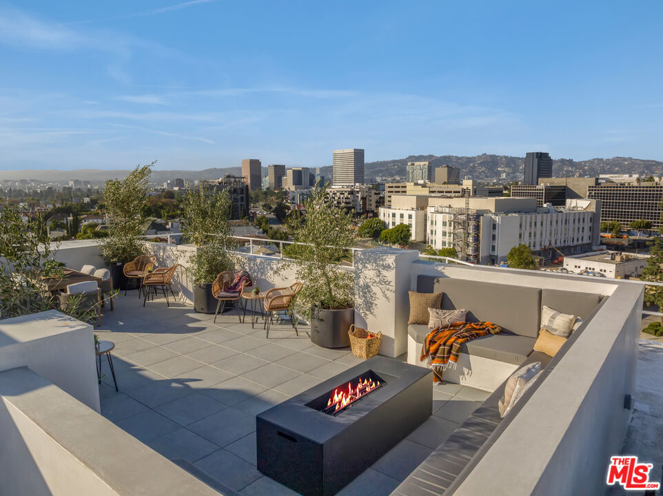 1110 South Spaulding Avenue, Unit 305 Los Angeles, CA 90019 - Photo 10 of 13 a view of city from terrace along with seating space