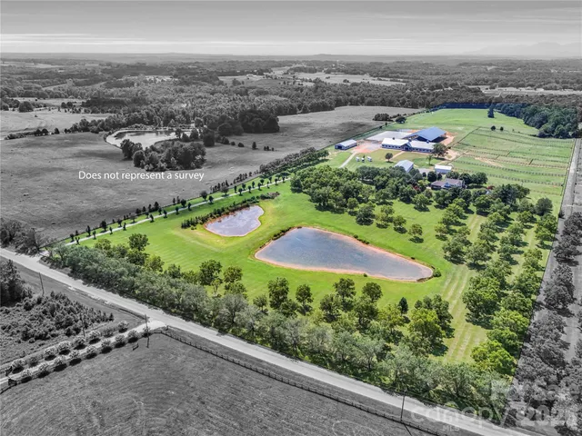 an aerial view of a house with garden space and outdoor space