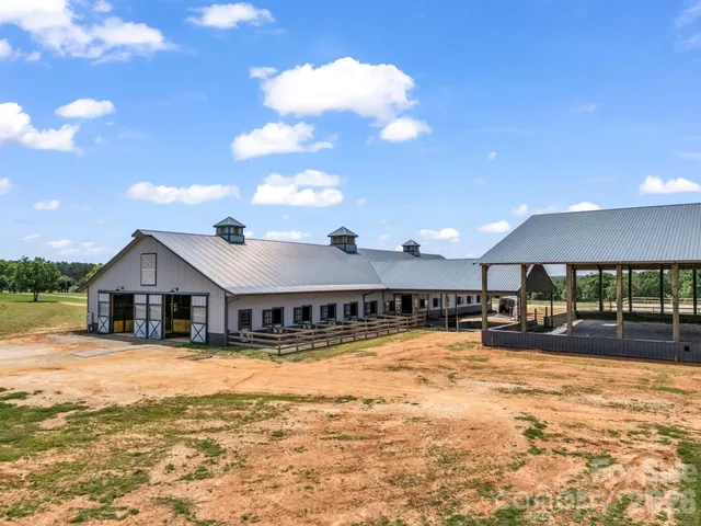 a view of a swimming pool with an outdoor seating and a garden