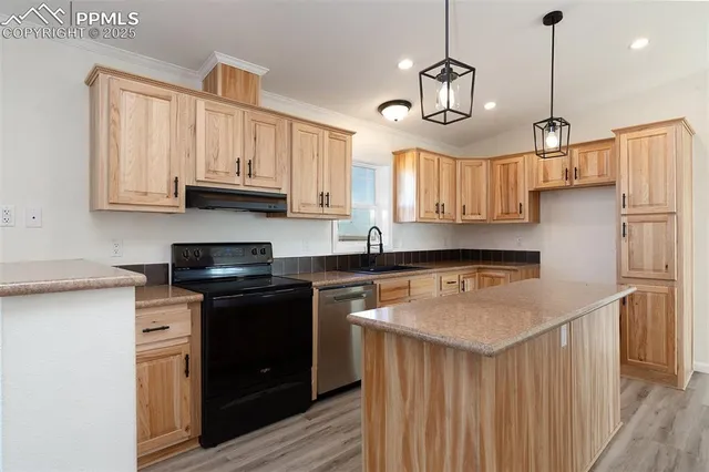 a kitchen with kitchen island granite countertop lots of counter top space and wooden floor