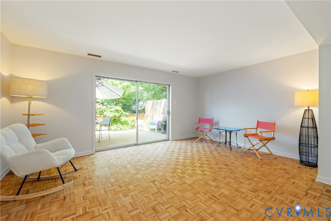 9129 Derbyshire Road, Unit E Henrico, VA 23229 - Photo 13 of 36 Spacious room featuring parquet wood-finish floori