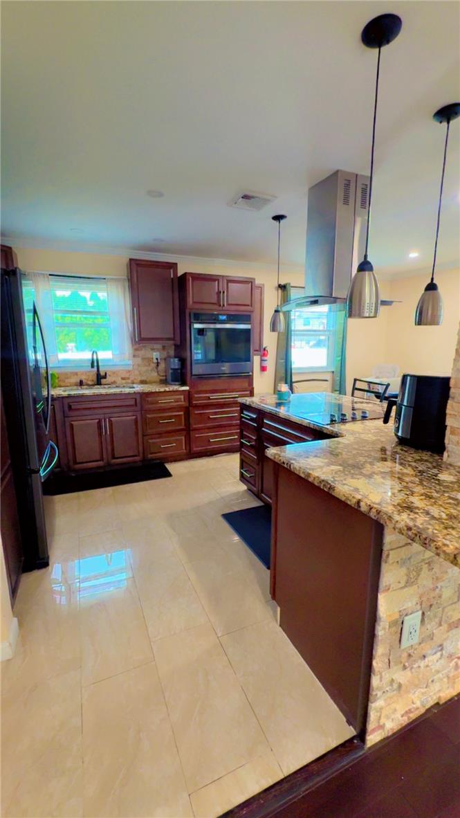 1844 29th Street Southwest Allentown, PA 18103 - Photo 7 of 37 Gleaming tile floors and rich wood cabinetry define this spacious kitchen space.