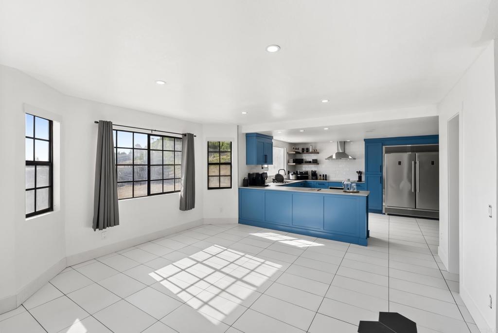 9309 Hillside Drive Spring Valley, CA 91977 - Photo 19 of 64 a kitchen with stainless steel appliances granite countertop a refrigerator and a sink