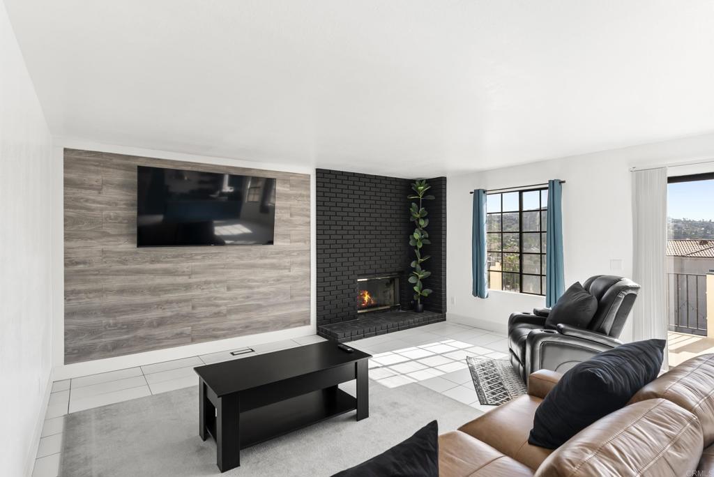 9309 Hillside Drive Spring Valley, CA 91977 - Photo 20 of 64 a living room with furniture and a flat screen tv