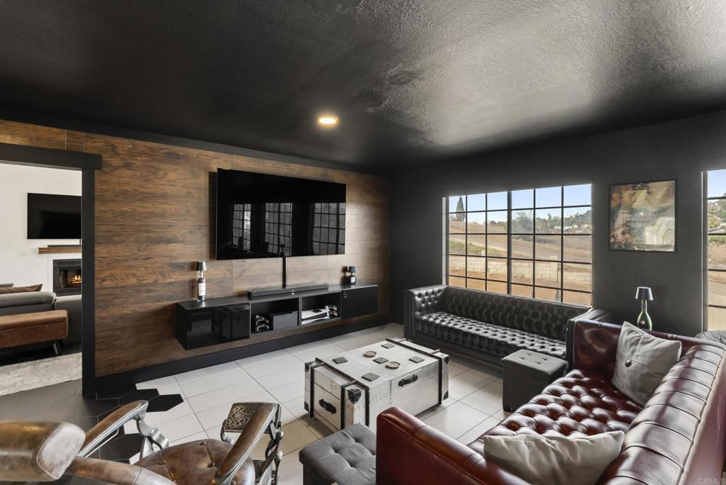 9309 Hillside Drive Spring Valley, CA 91977 - Photo 24 of 64 a living room with furniture and a flat screen tv