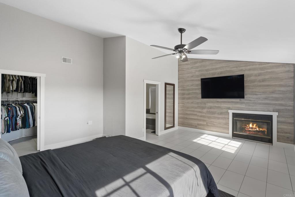 9309 Hillside Drive Spring Valley, CA 91977 - Photo 35 of 64 a bedroom with a bed and a fireplace