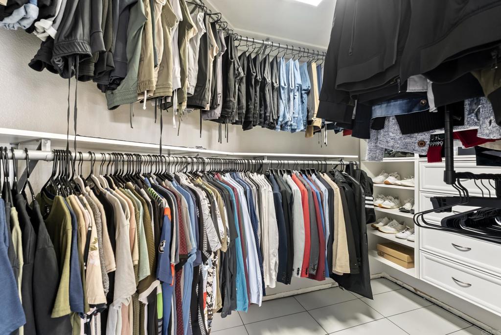 9309 Hillside Drive Spring Valley, CA 91977 - Photo 40 of 64 a view of walk in closet with clothes and shoes