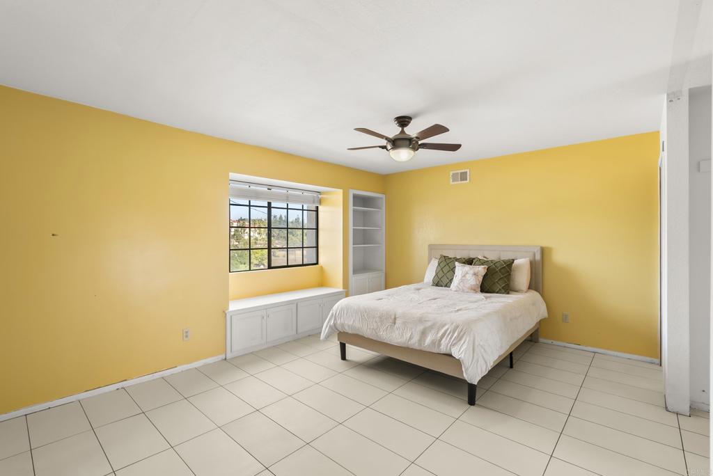 9309 Hillside Drive Spring Valley, CA 91977 - Photo 41 of 64 a bedroom with a bed and a chandelier