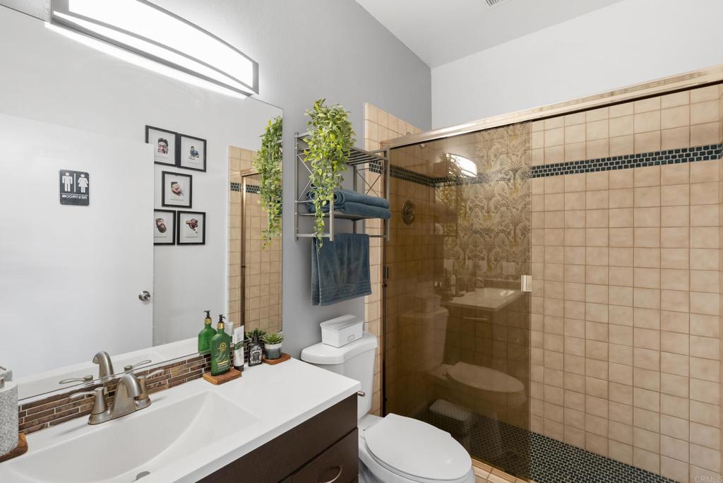 9309 Hillside Drive Spring Valley, CA 91977 - Photo 43 of 64 a bathroom with a sink toilet and shower