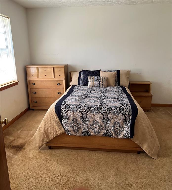 2741 Old Dawsonville Road Gainesville, GA 30506 - Photo 13 of 18 a bedroom with a bed and window