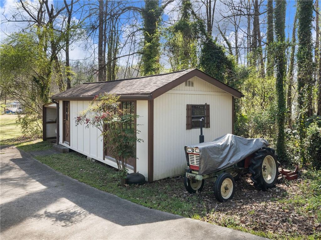 2741 Old Dawsonville Road Gainesville, GA 30506 - Photo 8 of 18 a view of a house with backyard and trees