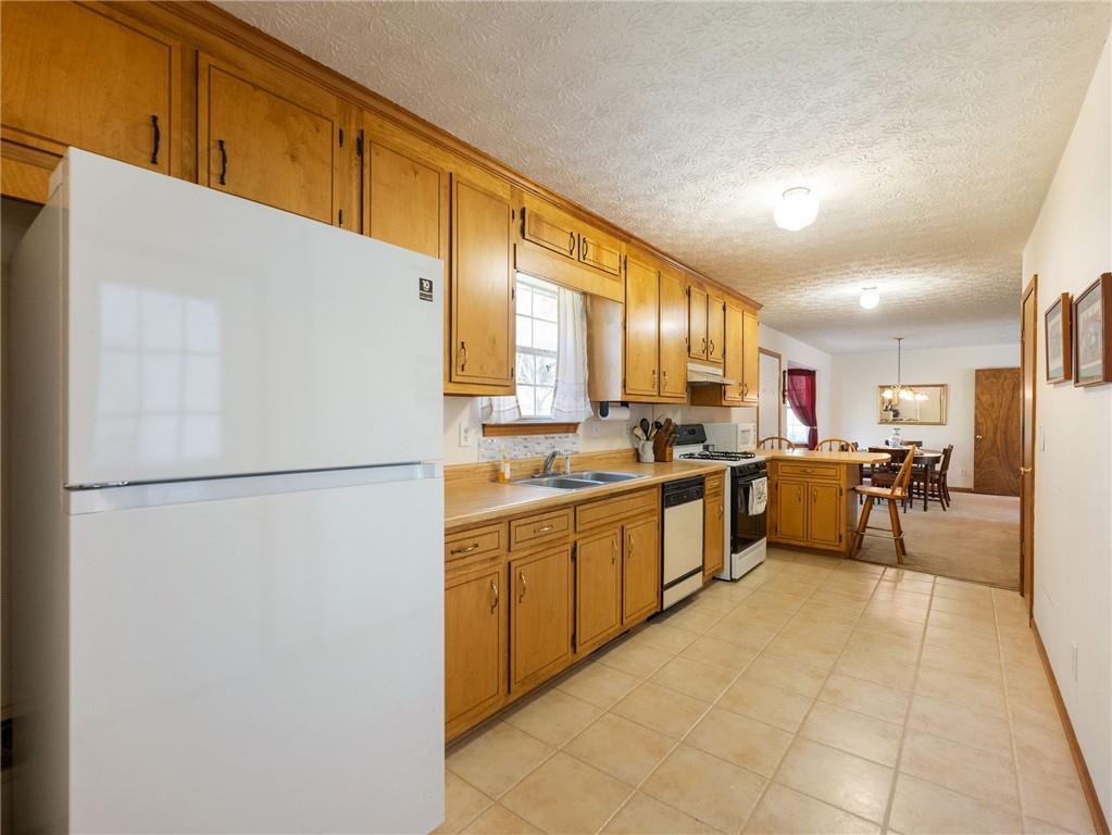 2741 Old Dawsonville Road Gainesville, GA 30506 - Photo 10 of 18 a kitchen with stainless steel appliances a refrigerator and a refrigerator