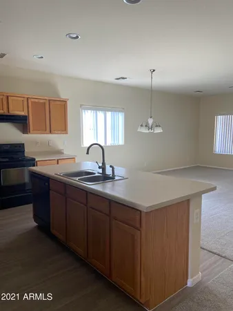 a kitchen with a sink and cabinets