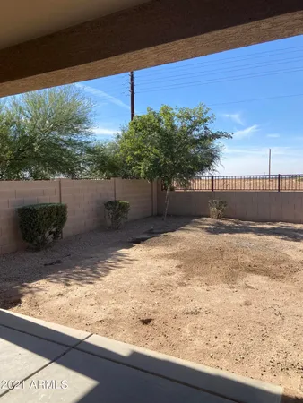 a view of a backyard of the house