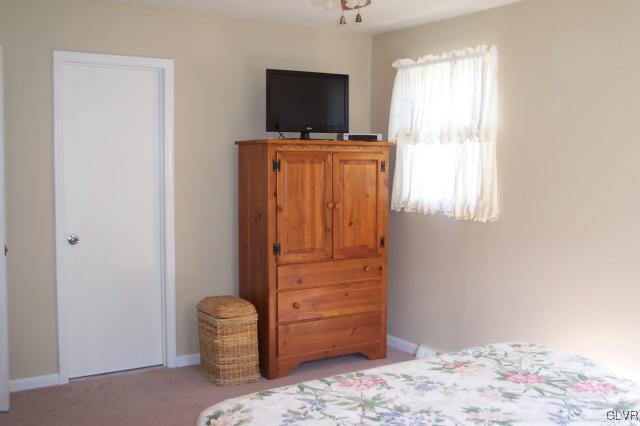 2131 Hendricks Road Pennsburg, PA 18073 - Photo 18 of 30 a bedroom with a bed and flat screen tv