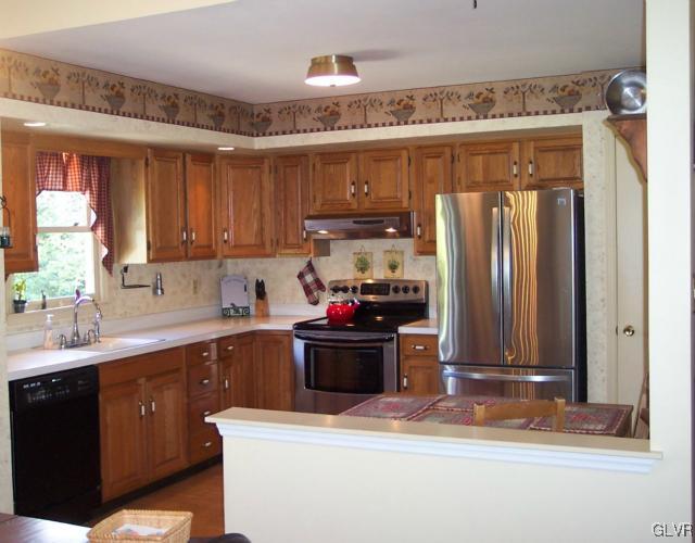 2131 Hendricks Road Pennsburg, PA 18073 - Photo 4 of 30 a kitchen with a refrigerator and a sink