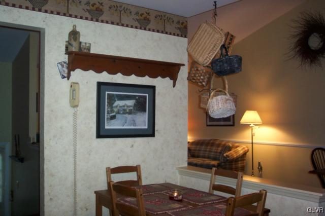 2131 Hendricks Road Pennsburg, PA 18073 - Photo 5 of 30 a table with chairs and a stove