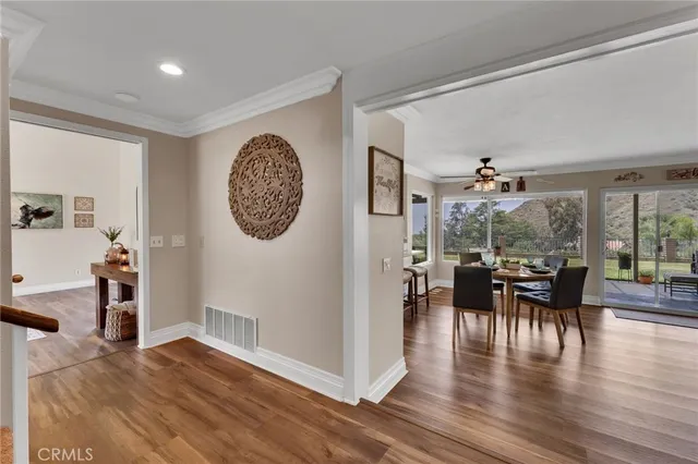a view of a dining room with furniture window and wooden floor