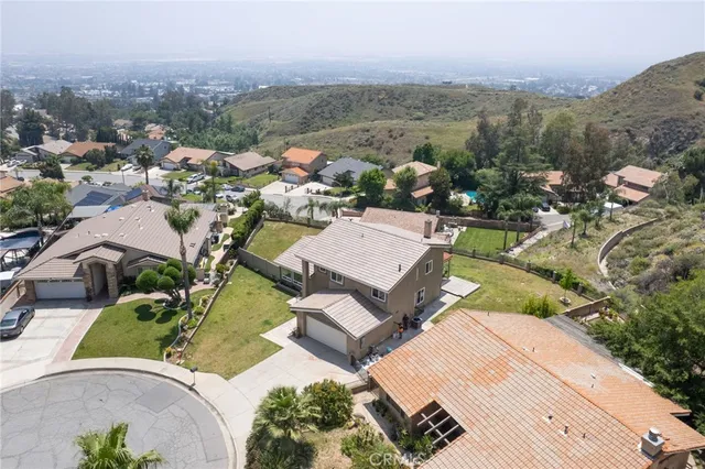 an aerial view of a house with a garden