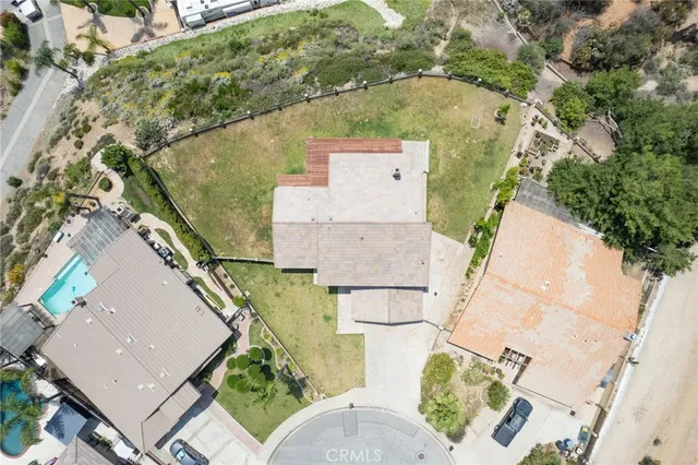 an aerial view of a house with outdoor space