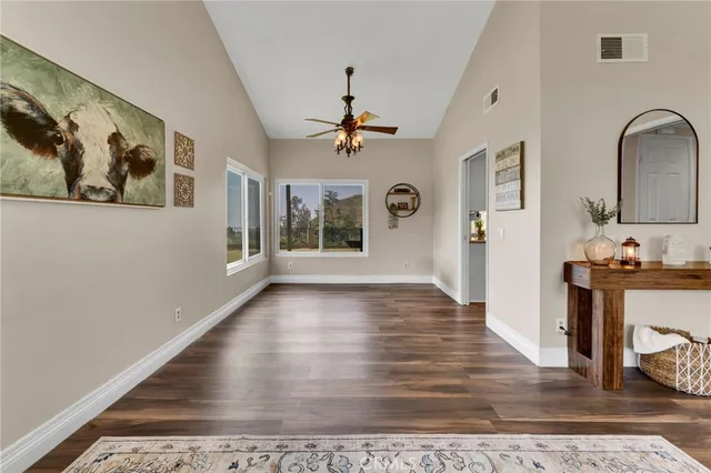 a view of an entryway with wooden floor