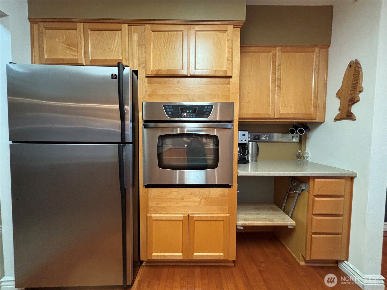 221 North Bay Lane, Unit 2 Port Ludlow, WA 98365 - Photo 13 of 35 a kitchen with a refrigerator and a stove