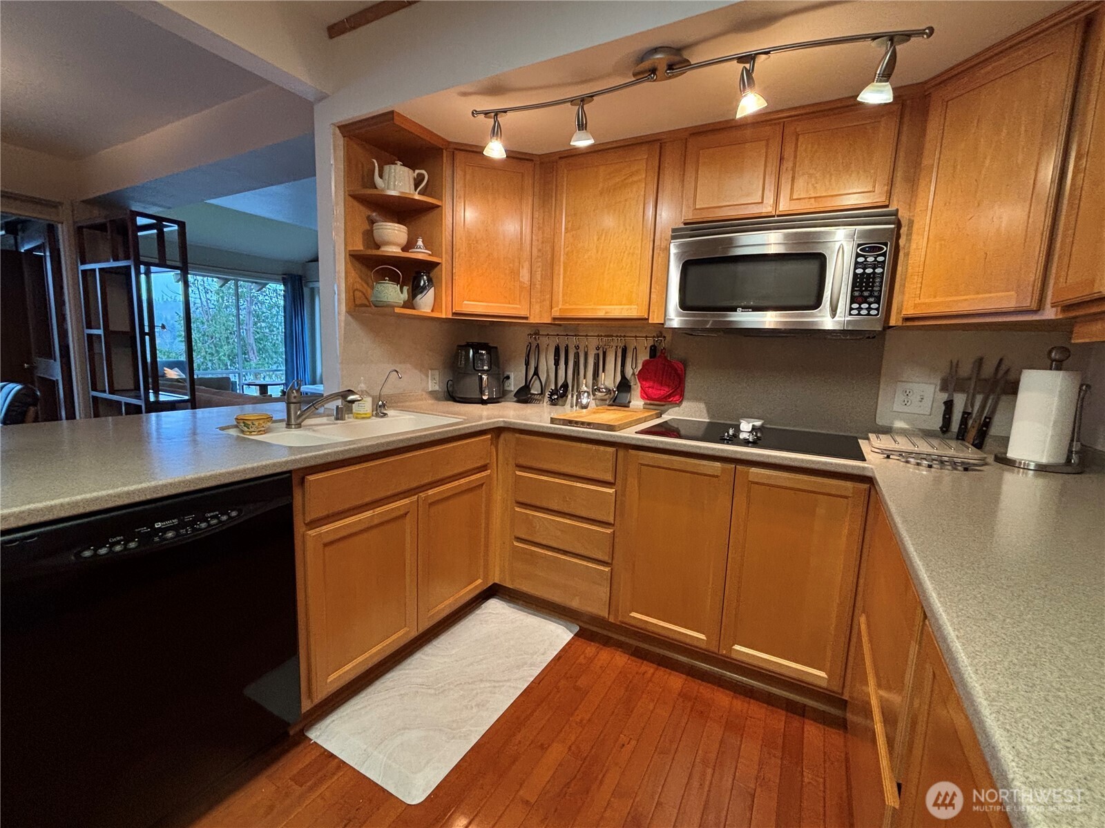 221 North Bay Lane, Unit 2 Port Ludlow, WA 98365 - Photo 14 of 35 a kitchen with a sink a stove and cabinets