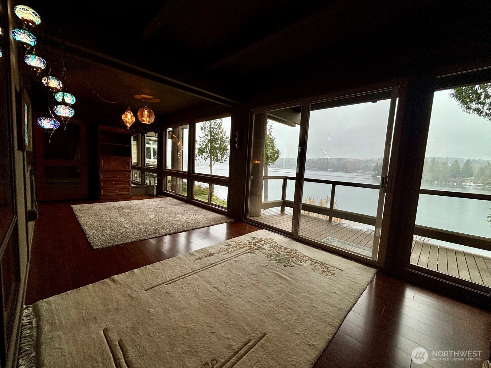 221 North Bay Lane, Unit 2 Port Ludlow, WA 98365 - Photo 17 of 35 a bedroom with a bed and a large window