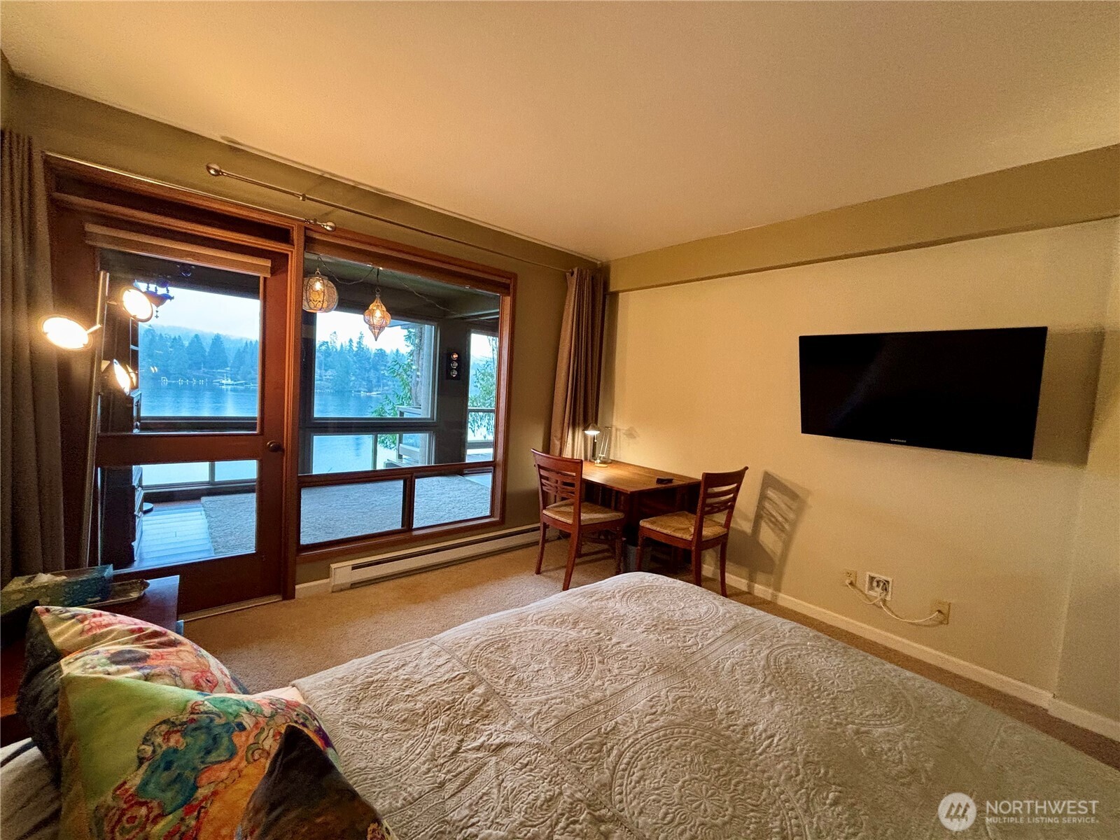 221 North Bay Lane, Unit 2 Port Ludlow, WA 98365 - Photo 25 of 35 a bedroom with furniture and a flat screen tv