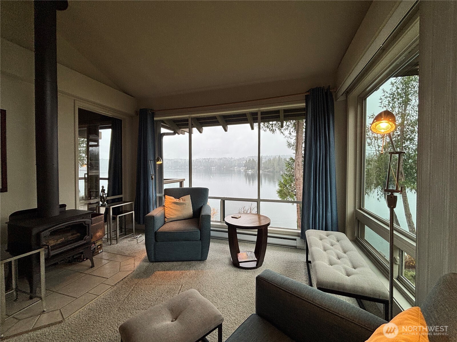221 North Bay Lane, Unit 2 Port Ludlow, WA 98365 - Photo 8 of 35 a living room with furniture and a large window