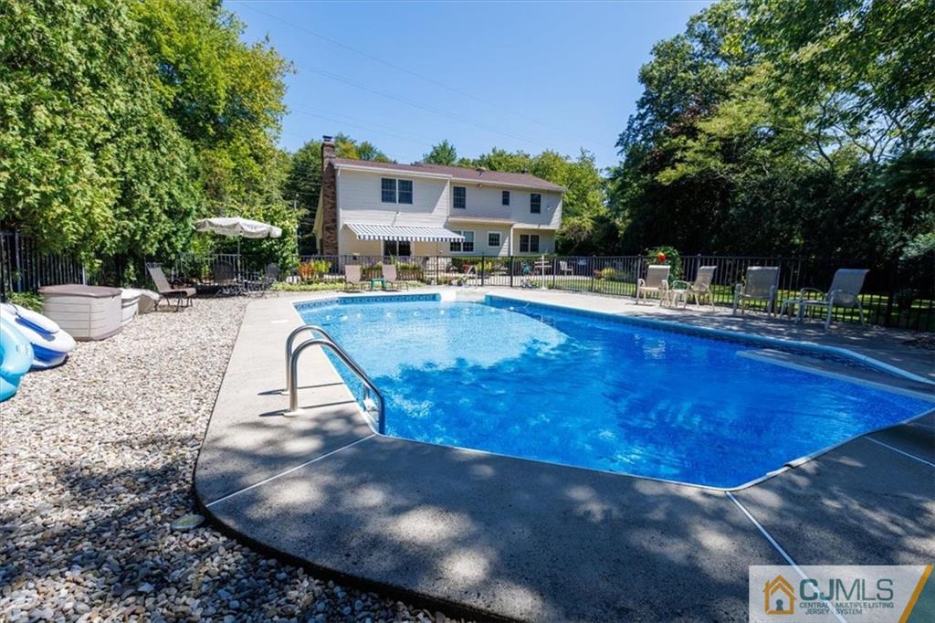 81 Spring Hill Road Old Bridge, NJ 07747 - Photo 12 of 40 a view of a swimming pool with lounge chair