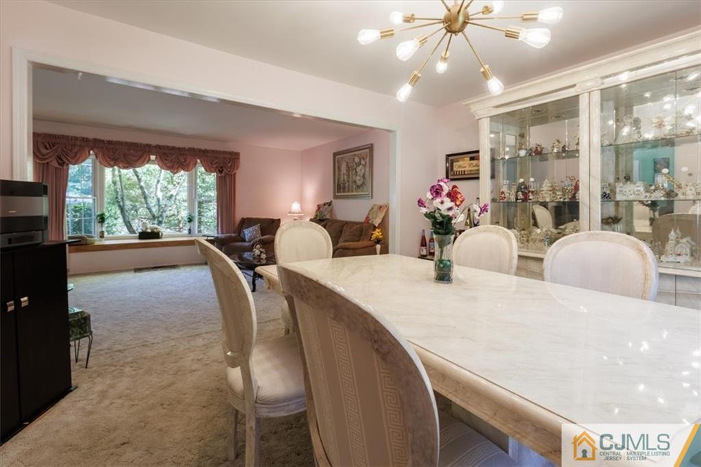 81 Spring Hill Road Old Bridge, NJ 07747 - Photo 19 of 40 a view of a dining room with furniture window and outside view