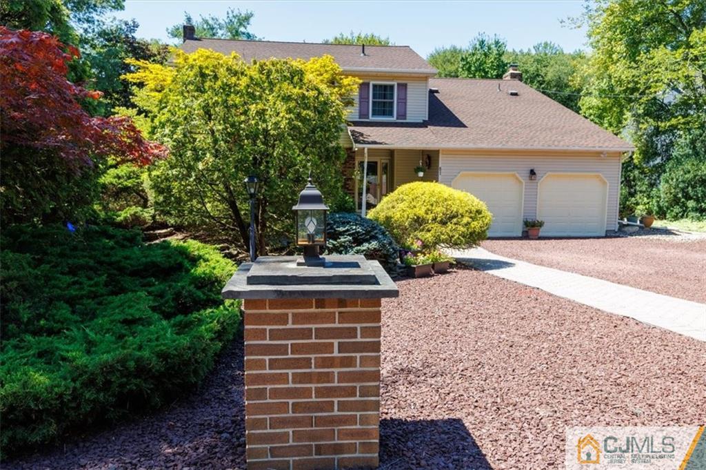 81 Spring Hill Road Old Bridge, NJ 07747 - Photo 2 of 40 a front view of a house with garden