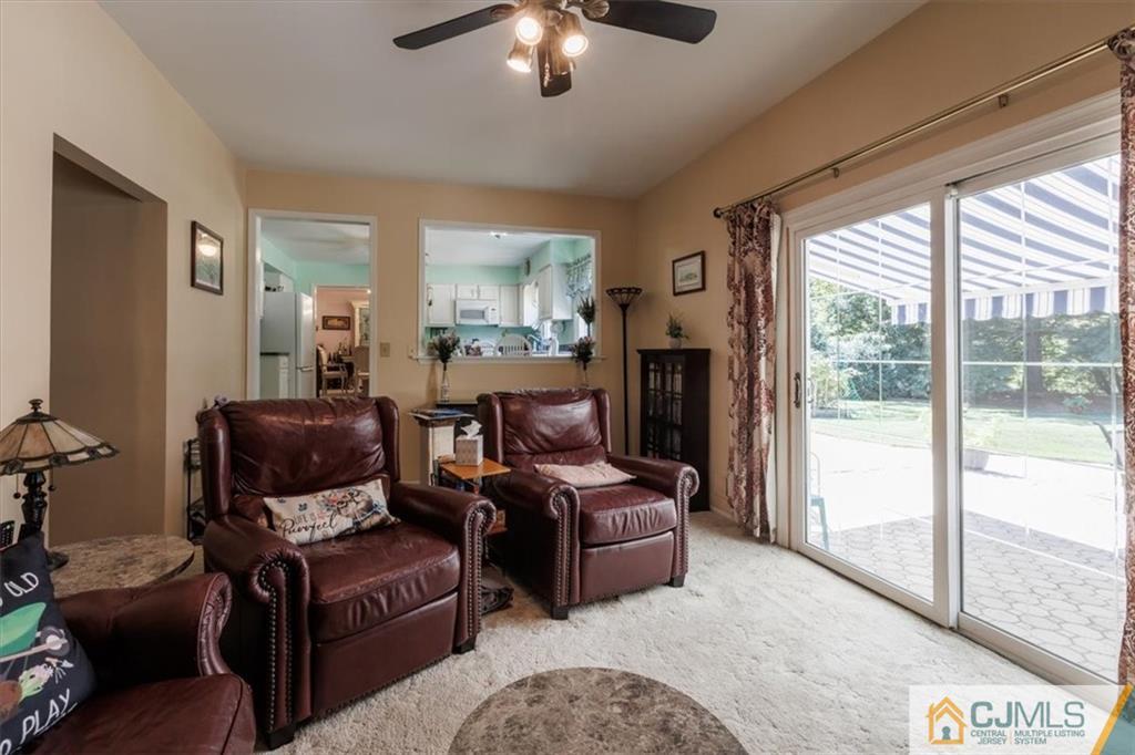 81 Spring Hill Road Old Bridge, NJ 07747 - Photo 25 of 40 a living room with furniture and a fireplace