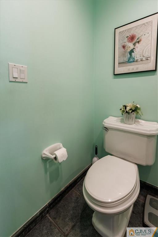 81 Spring Hill Road Old Bridge, NJ 07747 - Photo 26 of 40 a white toilet sitting next to a bathroom sink