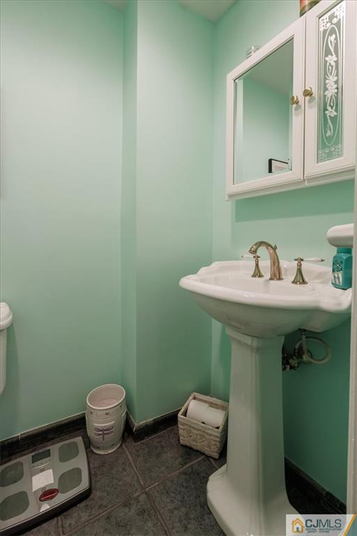 81 Spring Hill Road Old Bridge, NJ 07747 - Photo 27 of 40 a bathroom with a sink toilet and mirror