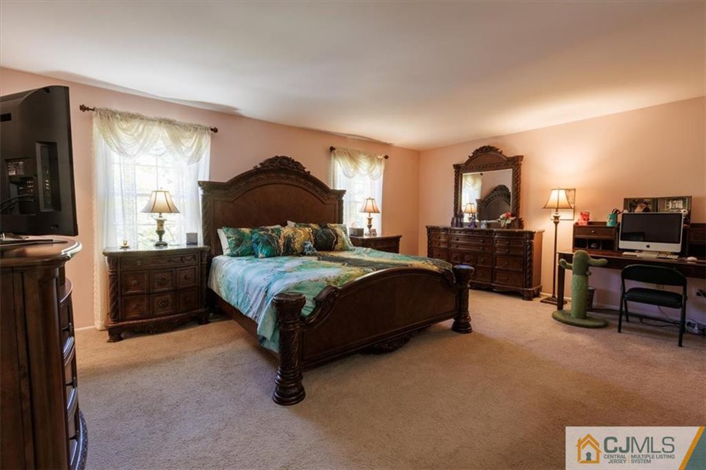 81 Spring Hill Road Old Bridge, NJ 07747 - Photo 29 of 40 a bedroom with a bed and a television