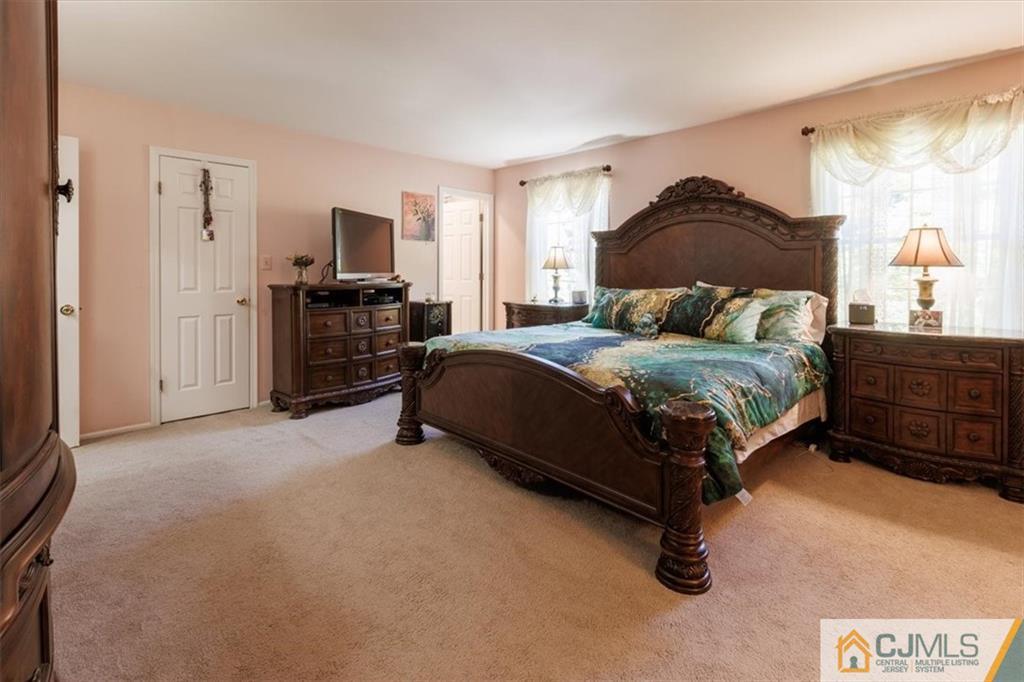 81 Spring Hill Road Old Bridge, NJ 07747 - Photo 30 of 40 a bedroom with a bed and a tv