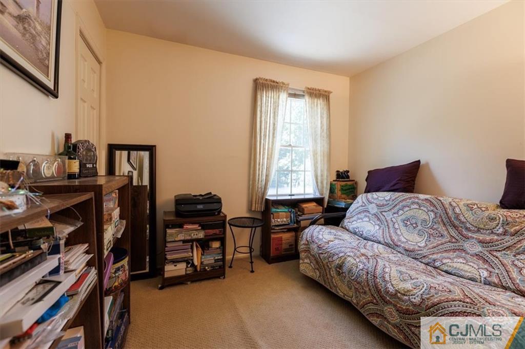 81 Spring Hill Road Old Bridge, NJ 07747 - Photo 34 of 40 a bedroom with a bed and a window