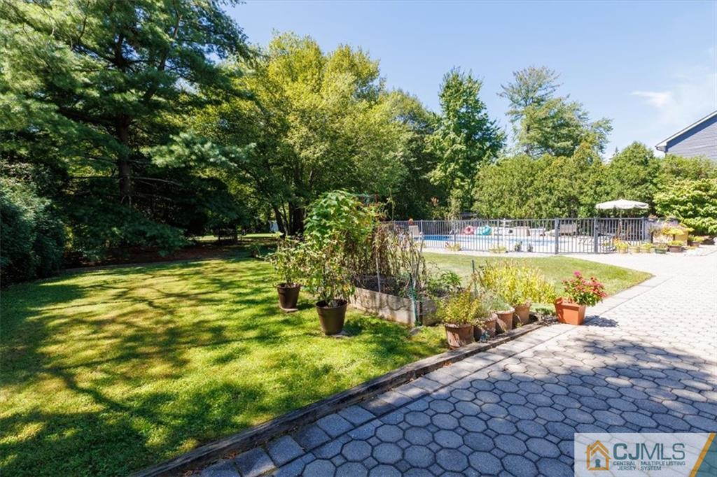 81 Spring Hill Road Old Bridge, NJ 07747 - Photo 6 of 40 a view of a swimming pool with a patio